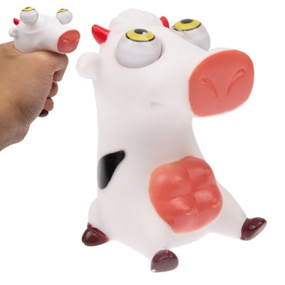 White pig eye toy figure with red ears, yellow eyes, and raised nose