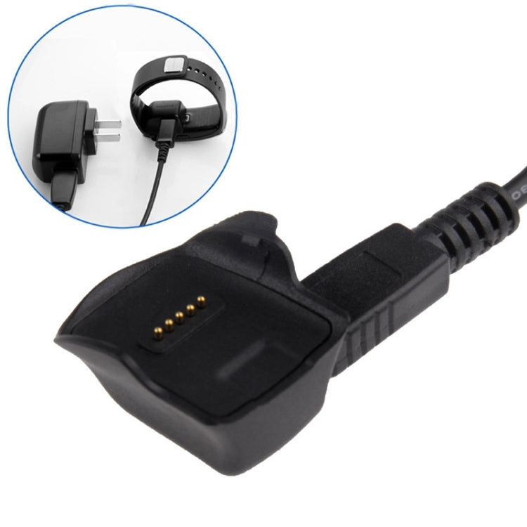 Black charging dock for bracelet with gold contact pins and cable connection