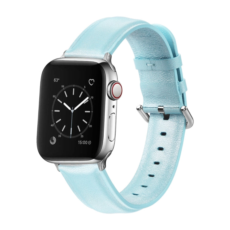 Light blue leather watch strap with round buckle and perforated holes, paired with smartwatch