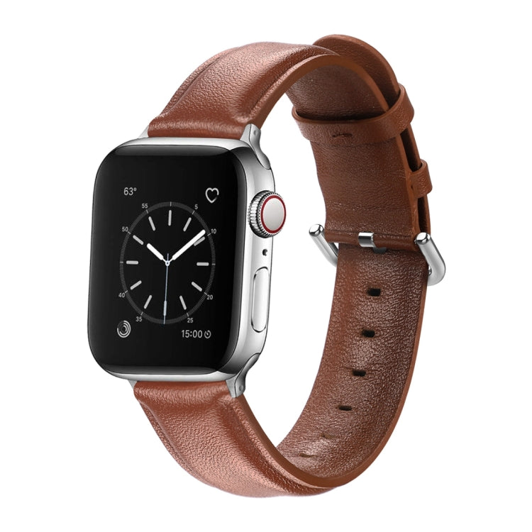 Brown leather watch strap with round buckle and perforated holes, paired with smartwatch