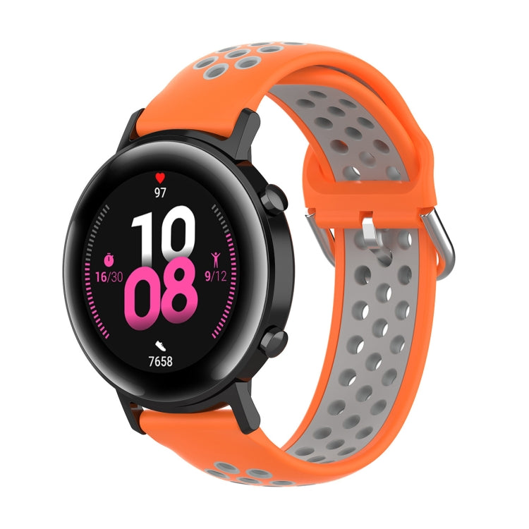Silicone watch strap with buckle, orange exterior and gray perforated inner band