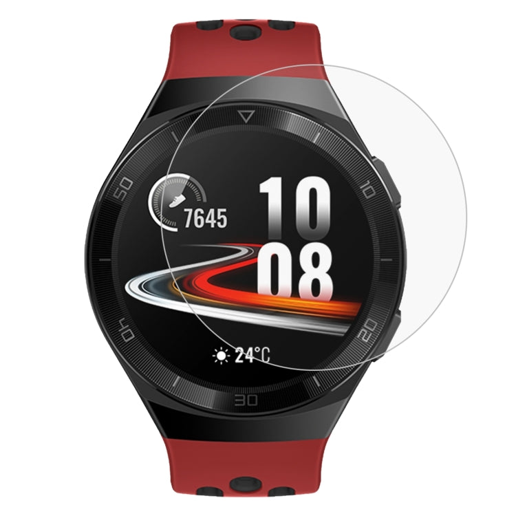 Tempered glass screen protector film on red-and-black smartwatch display, rounded edges