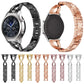 Assorted stainless steel watch straps with X-shaped diamond insets, multiple colors