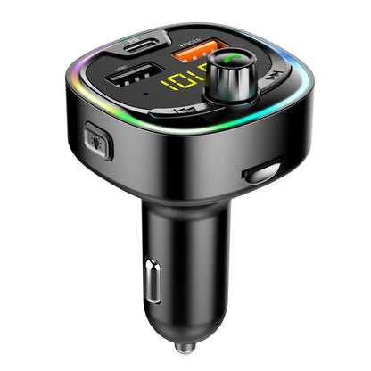 Black car FM transmitter with USB port and glowing control panel, hands-free call button
