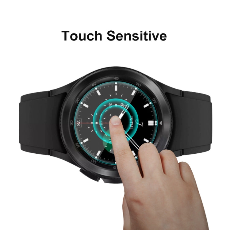 Tempered glass screen protector on smartwatch with fingertip touching the display