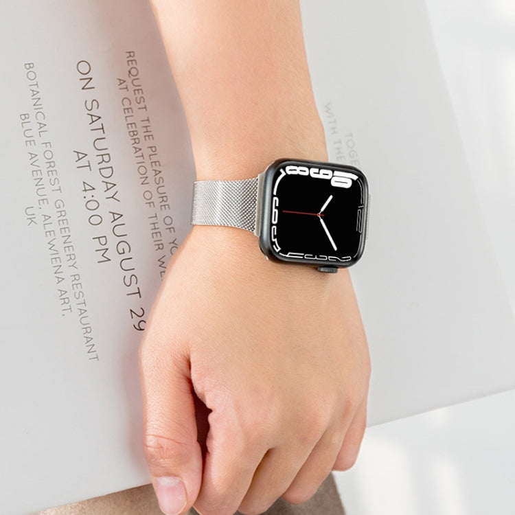 Silver Milanese mesh band worn on black Apple Watch with red hands