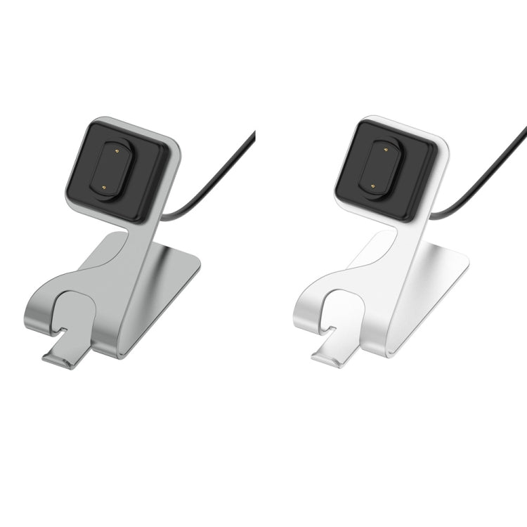 Grey and silver magnetic stands with angled watch cradles and charging cables.