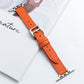 Microfiber leather pin buckle watch strap in orange with stitched holes and metal buckle