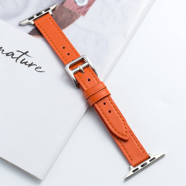 Microfiber leather pin buckle watch strap in orange with stitched holes and metal buckle