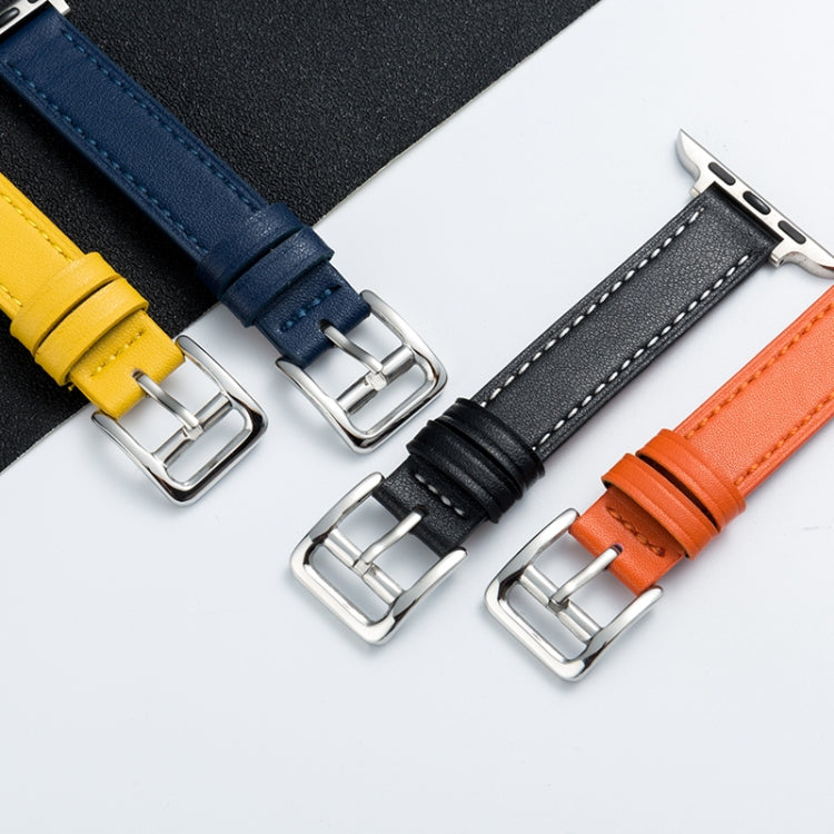 Microfiber leather pin buckle watch strap close-up with dark blue, black, and orange buckles