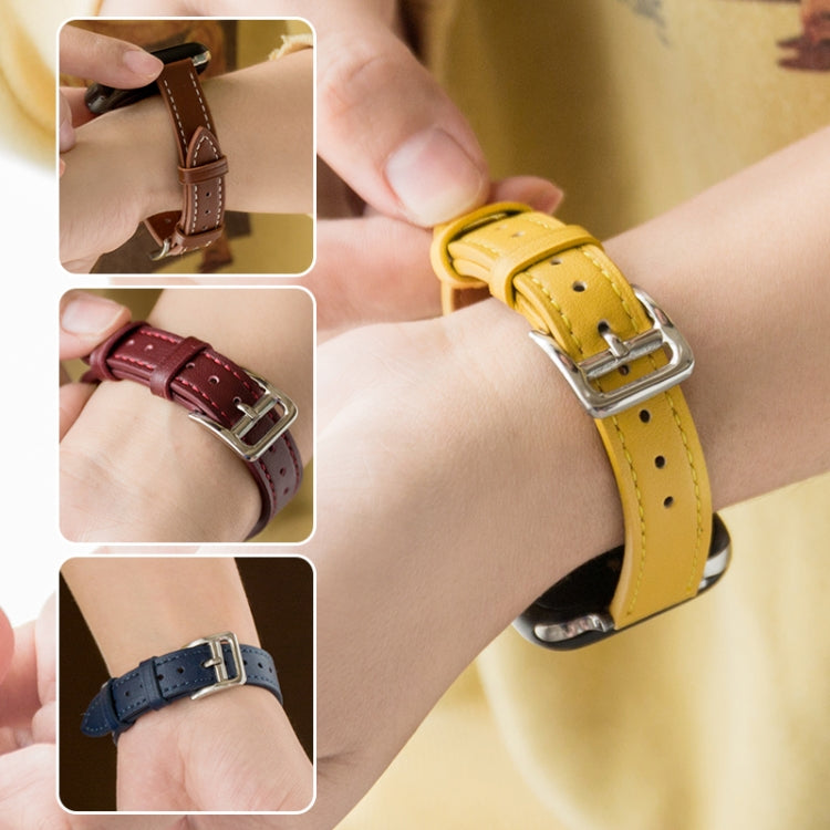 Microfiber leather pin buckle watch strap in yellow, shown on wrist with metal buckle