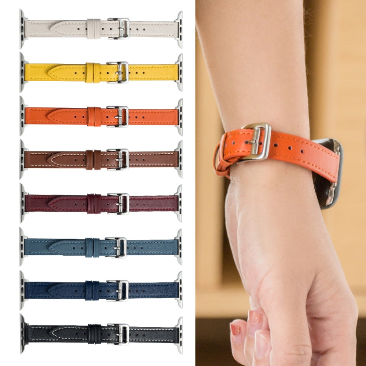 Microfiber leather pin buckle watch strap, orange with metal buckle, shown on wrist