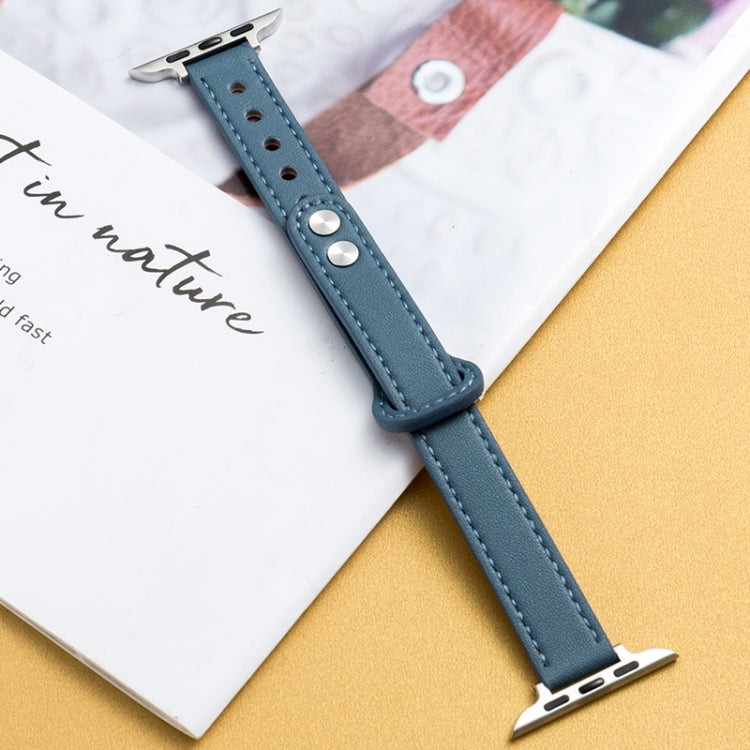 Light blue microfiber leather watch strap with double buckle, metal pins and clasp, stitched edge.