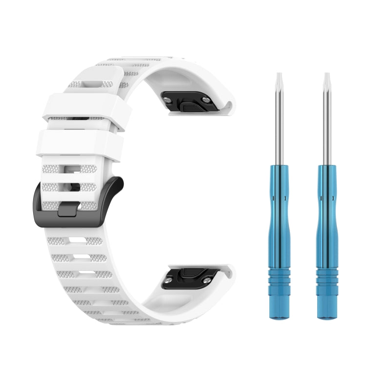 White silicone sports watch strap with spring bar tools and adjustable buckle.