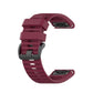 Silicone sports watch strap, burgundy red, with adjustable holes and buckle.