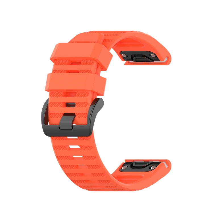 26mm orange silicone sports watch strap with perforated texture and quick-release pins