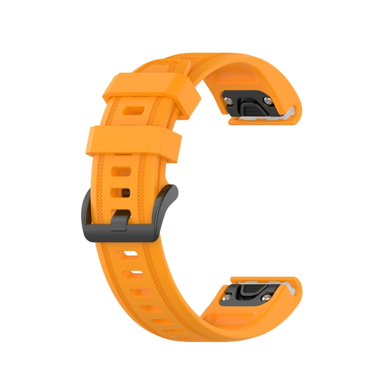 Orange silicone quick-release watch strap with pin-and-buckle clasp ends