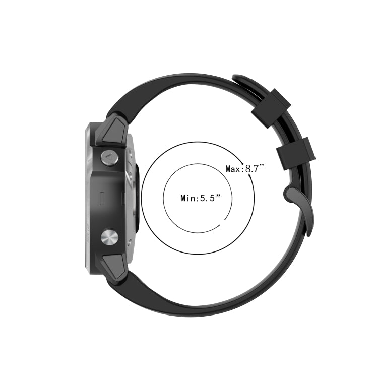 Black silicone quick-release strap on watch with clasp and adjustment range marks