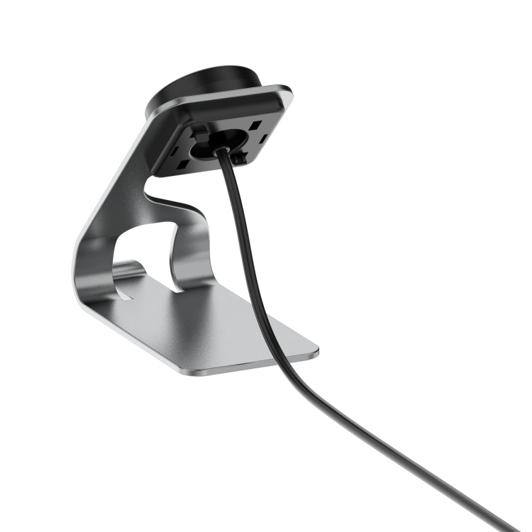 Angled view of metal smartwatch charger stand with black dock and silver support arms.