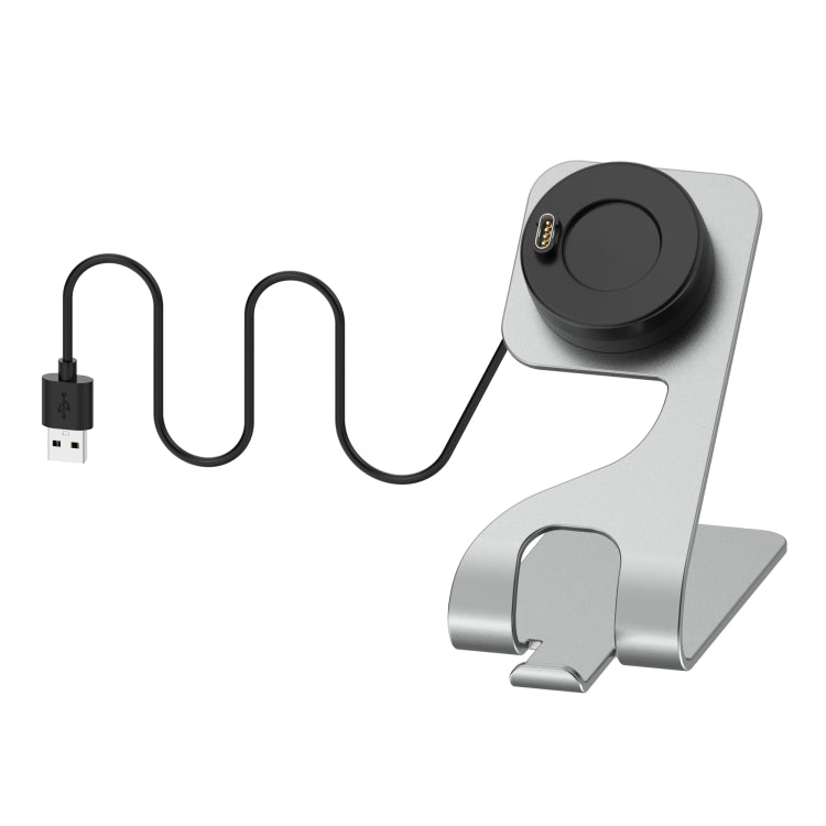 Silver and black metal charger stand for smartwatch with connected USB charging cable.