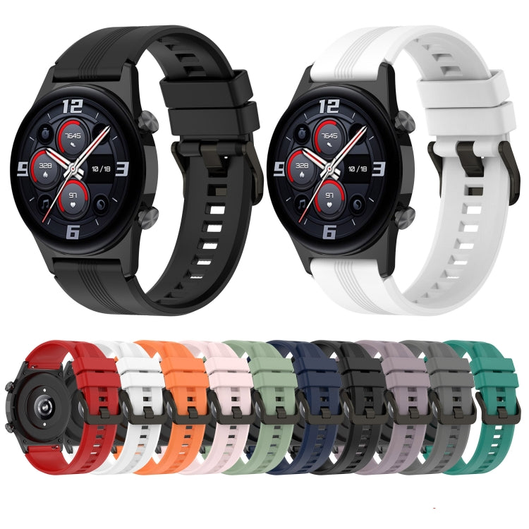 Silicone watch band with adjustable buckle, shown in black and white color options