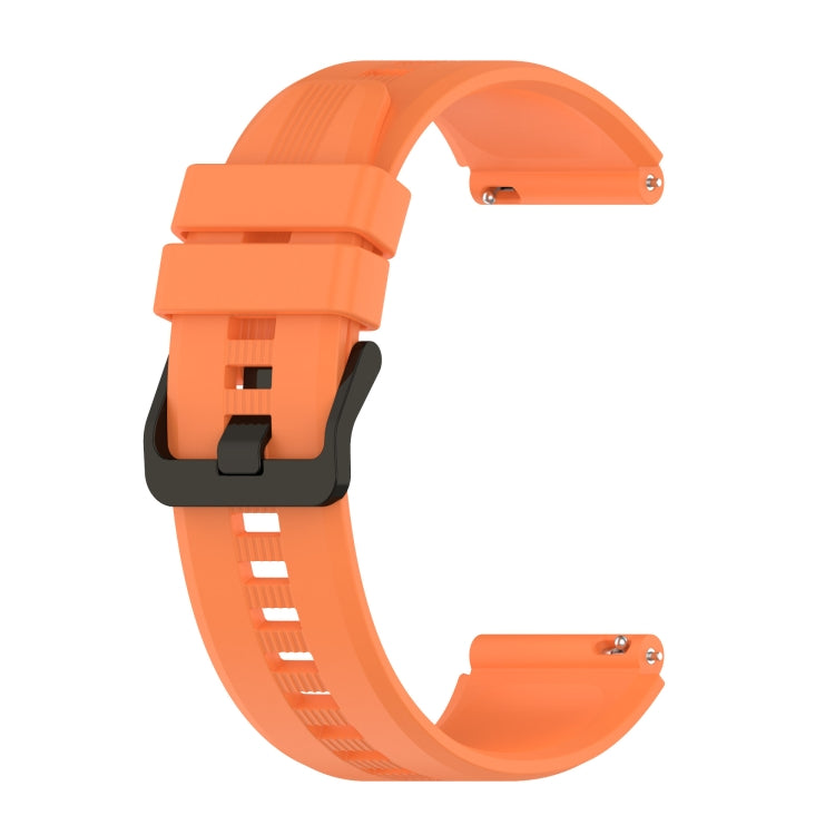 Silicone watch band in orange with quick-release clasp and perforated strap holes
