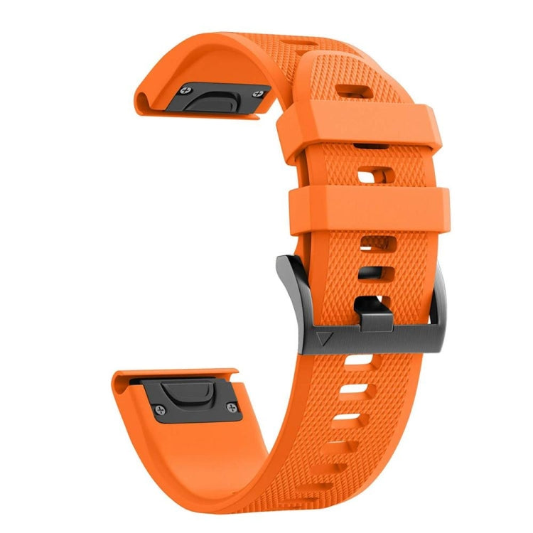Orange silicone watch strap with textured finish and black pin-buckle clasp