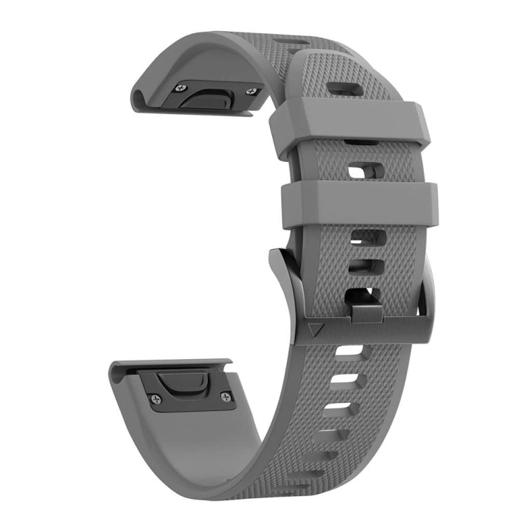 Grey silicone watch strap with perforated pattern and clasp hardware.