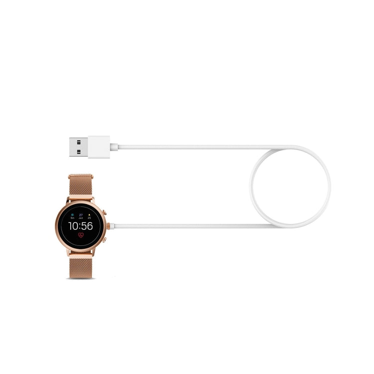 Universal watch charging cable connected to Fossil watch with brown leather strap
