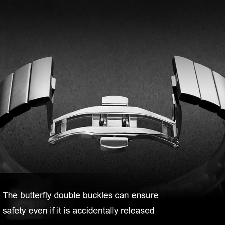 Silver metal watch band clasp underside with butterfly-style double buckle