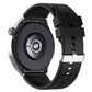 Black silicone watch strap with silver buckle, shown from side with clasp hardware
