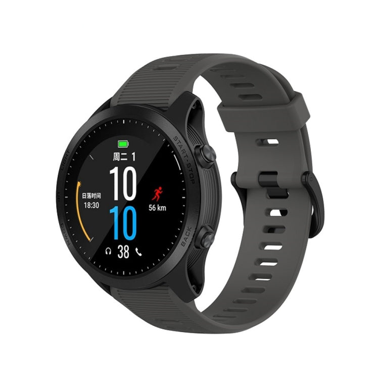 Black silicone smartwatch watch band with textured holes and quick-release buckle