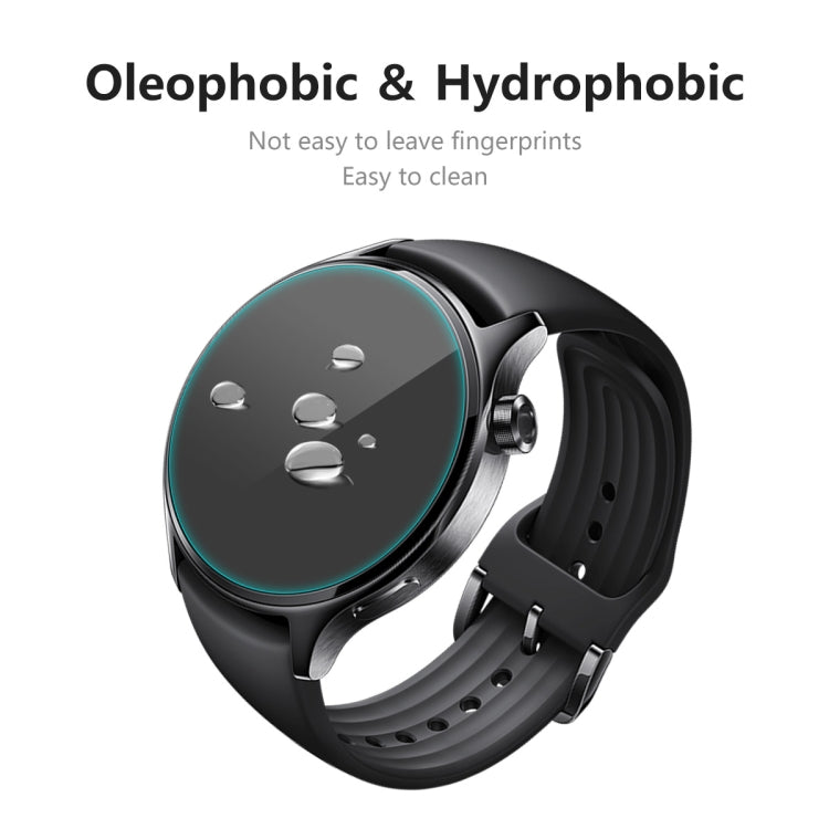 Black smartwatch with tempered glass screen protector showing water beading on glass surface
