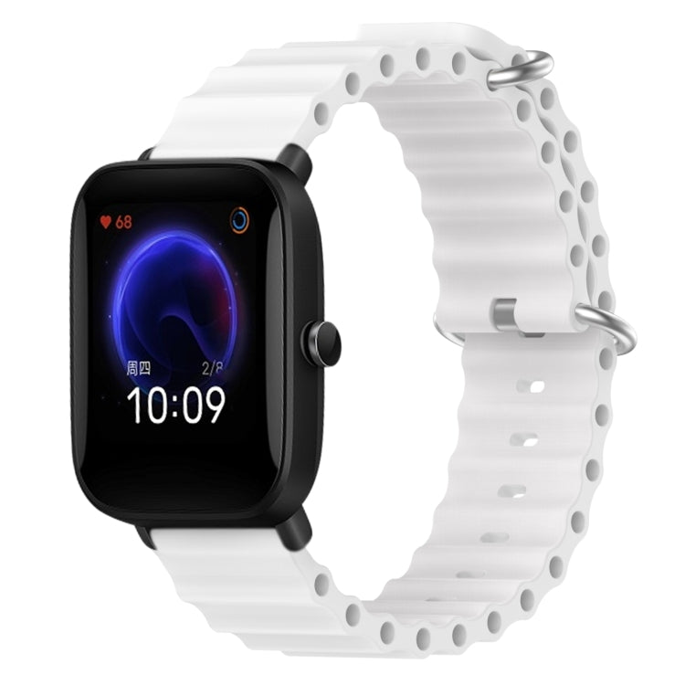 White silicone watch band with perforated links and metal pin clasp
