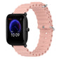 Pink silicone watch band with perforated links and metal pin clasp