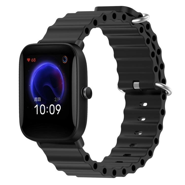 Black silicone watch band with perforated links and metal pin clasp