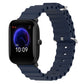 Dark blue silicone watch band with perforated links and metal pin clasp