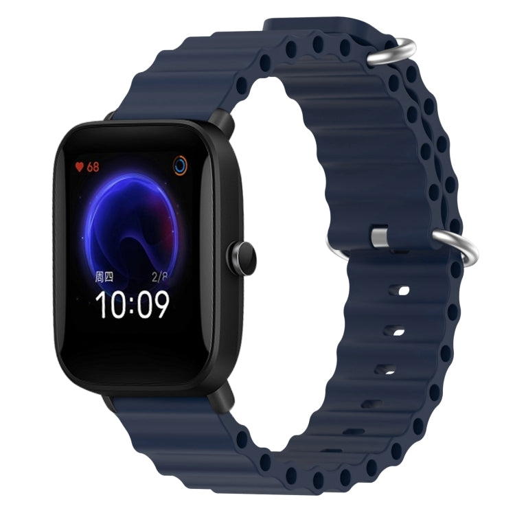 Dark blue silicone watch band with perforated links and metal pin clasp