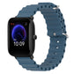 Blue silicone watch band with perforated holes and metal pin clasp