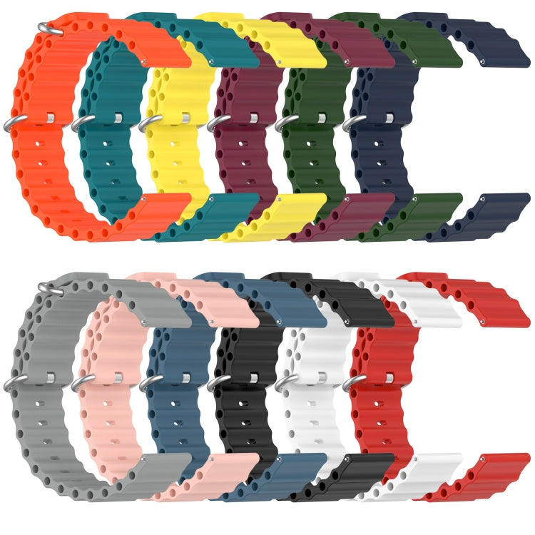 Multiple silicone watch bands in assorted colors, with metal pin buckle and round hole links