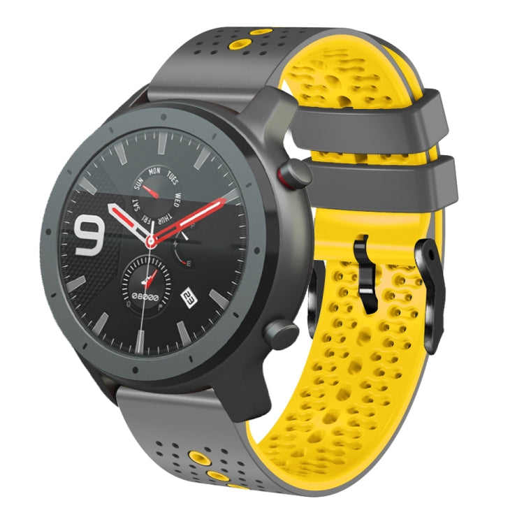 Perforated two-tone silicone watch band with yellow and black strap segments