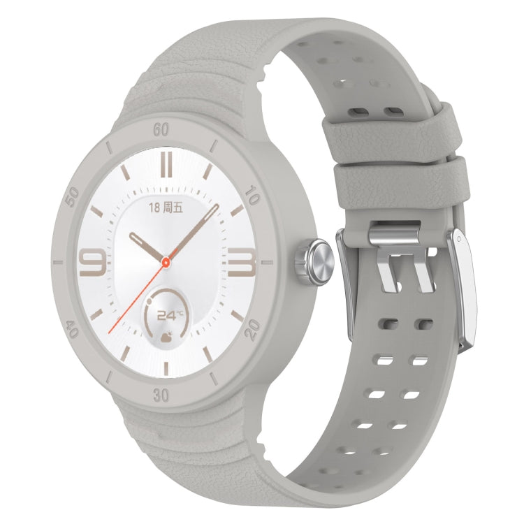 Grey silicone watch band with metal clasp and perforated strap holes