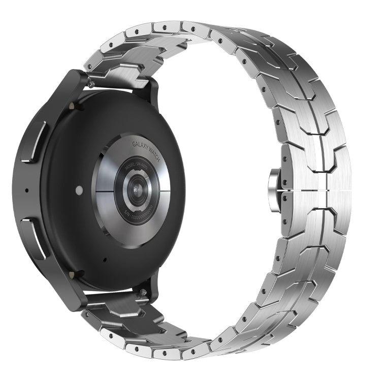 Silver stainless steel armor watch band with interlocking links.