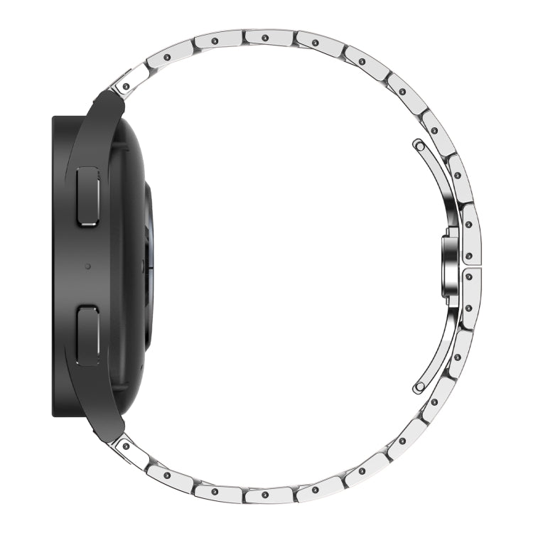 Silver stainless steel watch band with armor links and black clasp side.