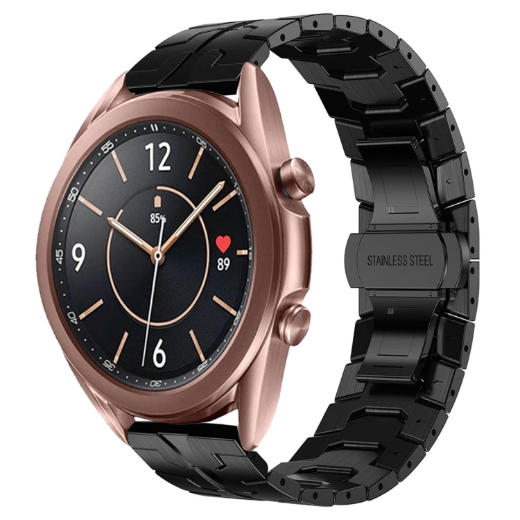 Rose gold watch with black stainless steel armor band links.