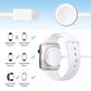 Magnetic charging cable with round puck and white smartwatch on wristband