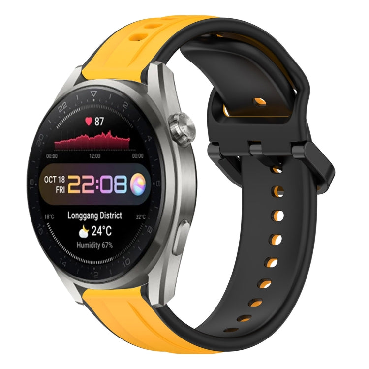Two-color 22mm silicone watch band with convex loop, black base and yellow-orange top.