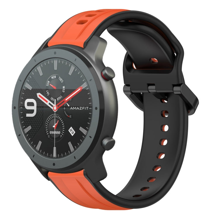 Two-tone silicone watch band with orange and black loop design, perforated pin-hole strap