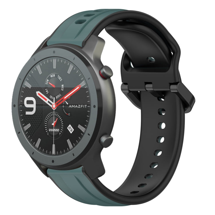 Two-tone silicone watch band with dark green and black loop design, adjustable pin holes