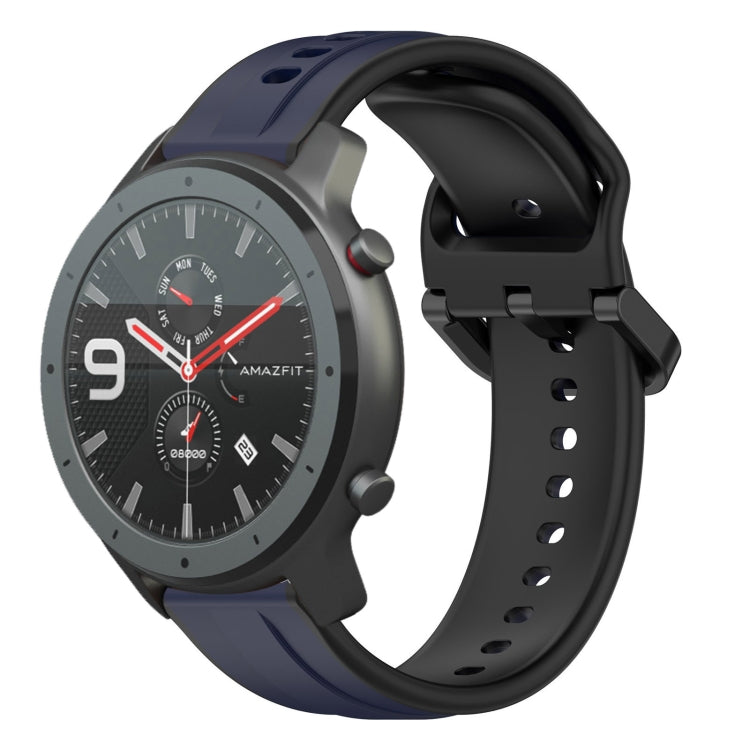 Two-color silicone watch band with dark blue outer loops and black perforated strap.